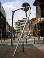 Image 68Statue of a tripod from The War of the Worlds in Woking, England, the hometown of author H. G. Wells. The book is a seminal depiction of a conflict between mankind and an extraterrestrial race. (from Culture of the United Kingdom)