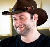 Creator and showrunner Dave Filoni wrote all eight episodes of the first season, continuing storylines that he established in the animated series Star Wars: The Clone Wars and Star Wars Rebels Dave Filoni crop.jpg