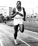 Hayes, 1962 FAMU athlete Robert Hayes practices running on the track.jpg