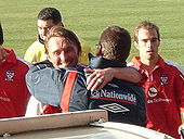 Brass hugs Viv Busby after a win for York City in 2004 Chris Brass.jpg