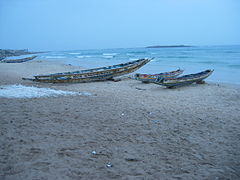 Fishing boats at Mbour, Senegal constructed along the lines of a large canoe using planks.