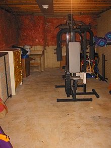 An unfinished basement used for storage and exercise Basement-after.jpg