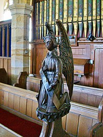 Bench end in the shape of an angel