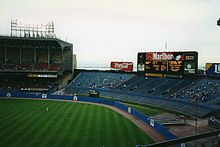 View of center field in 1993. Lake Erie is visible just outside the stadium. Visible beyond the outfield wall is a portion of the original (larger) outfield area. ClevelandMunicipalStadium1993Outfield.jpg