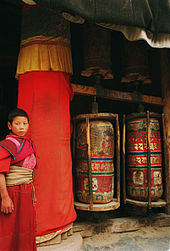 Young monk and prayer wheels Labrang02.jpg