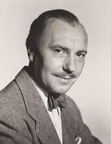 middle-aged man, receding hair, with neat moustache