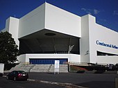 The corner of a white building in the daytime; the words "Continental Airlines" are visible on the right-hand side