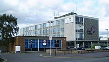 a side view of the Falkirk College Campus building with the main entrance at the bottom right and the road entering the campus at the bottom left