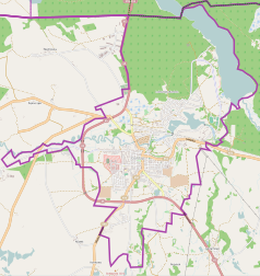 Mapa konturowa Gołdapi, blisko centrum na dole znajduje się punkt z opisem „Parafia św. Leona i św.Bonifacego”