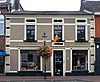 Winkel met bovenwoning