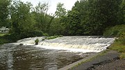 The river passes a weir in the Dartry area