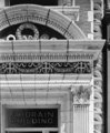 A detail of the ornate terra cotta decoration adorning the building's entrance