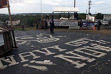 U.S. Navy officials dismantling makeshift buildings erected by protesters. Navy Vieques Protests.JPEG