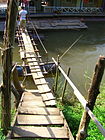 Two-plank footbridge to stairs across water.jpg