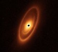 Image 55Astronomers used the James Webb Space Telescope to image the warm dust around a nearby young star, Fomalhaut, in order to study the first asteroid belt ever seen outside of the Solar System in infrared light. (from Cosmic dust)