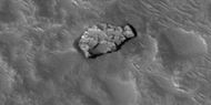 Close view of out of place rock, as seen by HiRISE under HiWish program. It may be a meteorite or it may have been tossed here by a nearby impact.