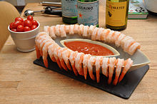 A shrimp cocktail served with cocktail sauce Shrimp cocktail.jpg