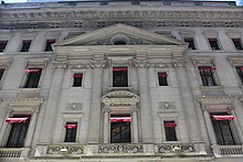 Facade of the central pavilion on 52nd Street, which includes a triangular pediment atop the windows