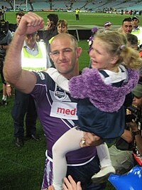 Geyer with his daughter celebrating the 2007 Grand Final Boffa.JPG