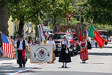 Southeastern New England is home to a number of Lusophone ethnic enclaves. Folkloric Rancho of the Portuguese Social Club, Pawtucket, in the 2021 Bristol Fourth of July parade.jpg