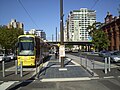 The City West tram stop - left-to-right: InterContinental Hotel, Riverside Building, Morphett Street bridge, multi-storey accommodation, the old Lion Flour factory