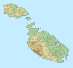 Map of the Maltese archipelago with a red dot on the coast of Mġarr, Malta showing the location of Għajn Tuffieħa.