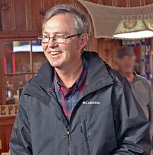 Leon Crosswhite smiling in a black Columbia jacket, shown from about the stomach up.