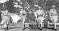 Image 26Lieutenant-General Arthur Percival, led by a Japanese officer, marches under a flag of truce to negotiate the capitulation of Allied forces in Singapore, on 15 February 1942. It was the largest surrender of British-led forces in history. (from History of Singapore)