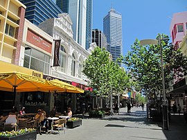 Shops and trees lining a car-less street