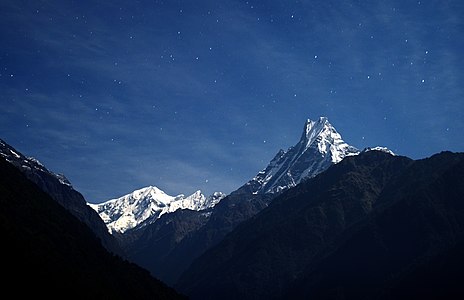 A view of Mount Machhapuchchhre (Mt. Fishtail) seen from Chomrong, Kaski, Nepal. Elevation:6,993 m (22,943 ft) Prominence :1,233 m (4,045 ft) नेपालको कास्की जिल्लामा अवस्थित छोमरोङवाट देखिएको माछापुच्छ्रे हिमालको एक मनोरम दृश्य ।उचाई:६,९९३ m (२२,९४३ ft) © Mohan K. Duwal