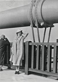 A pedestrian poses at the old railing on opening day, 1937.