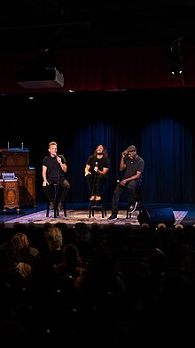 Millburn (left), Nicodemus (center), and Coleman speaking in 2022