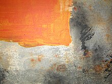 Opaque red/orange square in the upper-right corner looks opaque like oil paint. The textured grey/black area looks like watercolor.