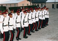 Soldiers in white-and-black dress uniforms