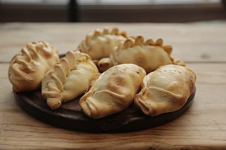 Empanada Baked or fried turnover consisting of pastry and filling