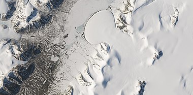 Romer Lake's Elephant Foot Glacier in the Earth's Arctic, as seen by Landsat 8. This picture shows several glaciers that have the same shape as many features on Mars that are believed to also be glaciers.