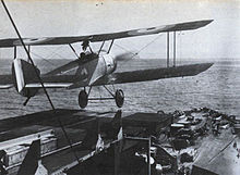 The Sopwith Pup of Flight Commander Rutland takes off from a platform on the forward gun turret of HMS Yarmouth, June 1917. Rutland-yarmouth.jpg