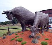 The Big Cows from slightly to the right, both painted brown to go with the chocolate factory to which they belong.