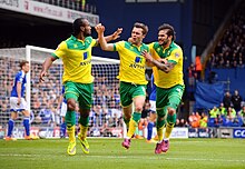 Howson celebrating his goal against rivals Ipswich Town in the first leg of the play-off semi-finals Howson goal.jpg