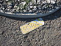 Damaged school sign in flood silt