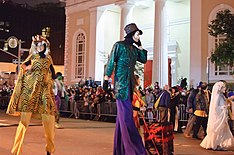 Children in costumes walking in the street