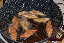 Fattigmenn are being deep-fried in oil for Christmas. Klejner koges.jpg