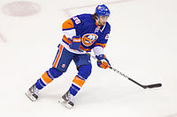 Matt Moulson skating with his hockey stick.