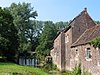 Ensemble van de molen van de abdij uit de 17e eeuw, de waterval en de omgeving