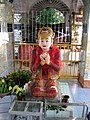 Sanda Muhki, the ogress, offering her own breasts to the Buddha