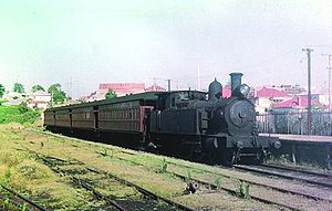 3079 stands at Belmont station with a passenger train on 4 August 1954 Belmont 052878.JPG