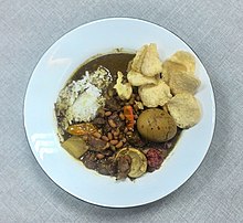 Nasi brongkos, brongkos stew with steamed rice and prawn cracker. Nasi Brongkos 3.jpg