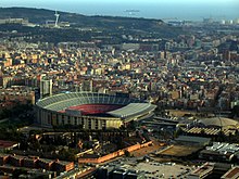 Barcelona stadium seen from above. It is a large and asymmetrically shaped dome.