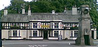 First World War Memorial Clock Tower in front of the Horse and Farrier pub Gatley horse.jpg