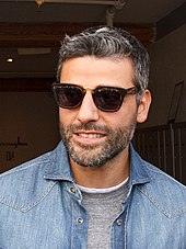 Oscar Isaac looking to his left